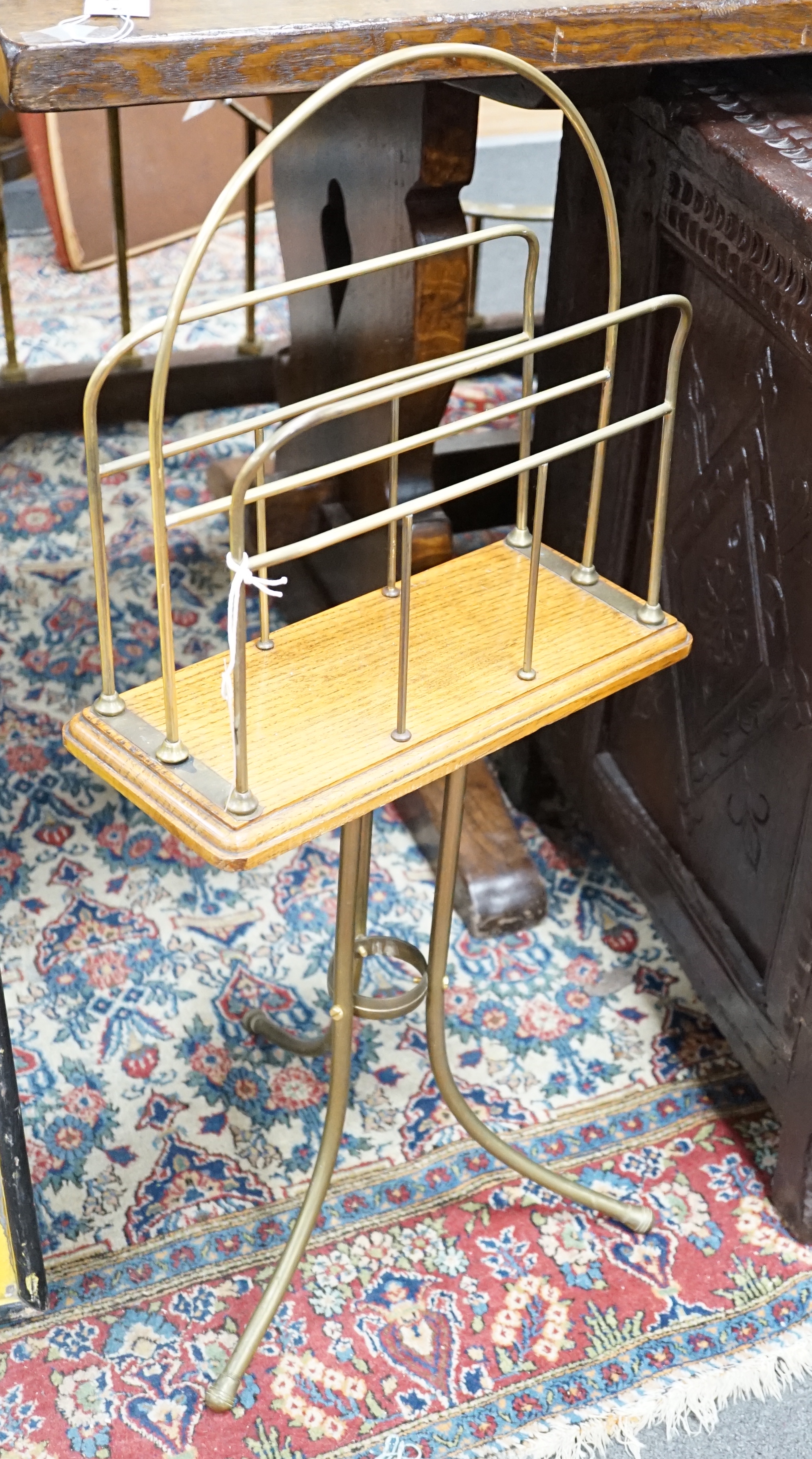 An Edwardian tubular brass and oak magazine rack, height 79cm